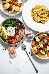 Set of festive meals of meat and vegetables and sweets on white background isolated. Menu set.