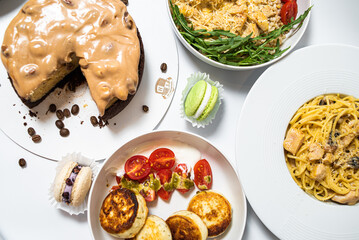 Set of festive meals of meat and vegetables and sweets on white background isolated. Menu set.