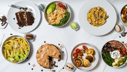 Set of festive meals of meat and vegetables and sweets on white background isolated. Menu set.