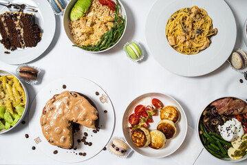 Set of festive meals of meat and vegetables and sweets on white background isolated. Menu set.
