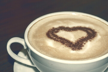 White cup with coffee. Delicious coffee. Coffee drink up close