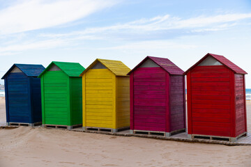 Fototapeta na wymiar Colorful wooden houses on the beach