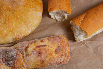 Fresh fragrant bread with green ears of wheat. grown and prepared in Ukraine