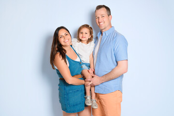 Mother with his baby daughter on studio white background