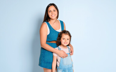 Mother with his daughter on studio white background