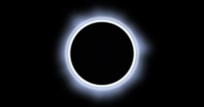 Animation of glowing white circle eclipse over black background