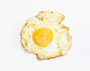 fried egg isolated on white background on top view. Food cooking