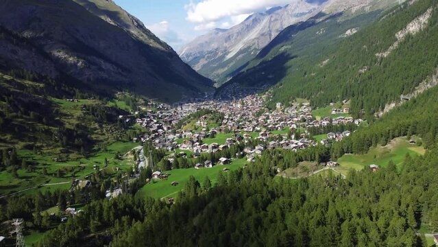 Aerial view of Zermatt, town under famous mountain Matterhorn, summer - landscapes of Swiss Alps from above, Switzerland, Europe. Drone footage 4K.
