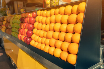 Juice bar and fruit shop stall at the city street. Retail small business and healthy beverage