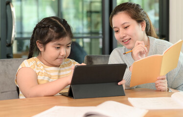 Asian girls study with a tutor, private lessons at home, sisters and sisters.