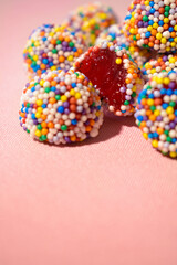 Yummy gummies on pink background