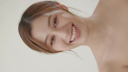 Young asian woman with beauty concept. Portrait of young beautiful lady posing at white background. She looking to camera with attractive smile at white background. - Powered by Adobe