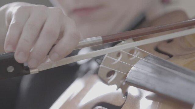 woman playing violin in band