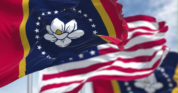 Mississippi state flags waving along with the national flag of the United States of America