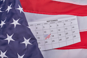 Constitution day of the United States 17th september top view flat lay. Fabric US flag with calendar.