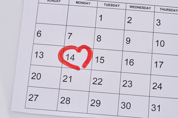 14 february day marked in calendar by red marker in the heart shape. Love day concept.