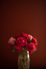red rose bouquet on dark red background