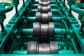 Closeup of a metal shaft parts of Lathe Machinery. Vintage Industrial Machinery in a old factory. Selective focus.	