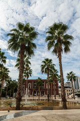 View of the fountains on the main square (Sheshi Liria) in Durres, Albania with the city hall