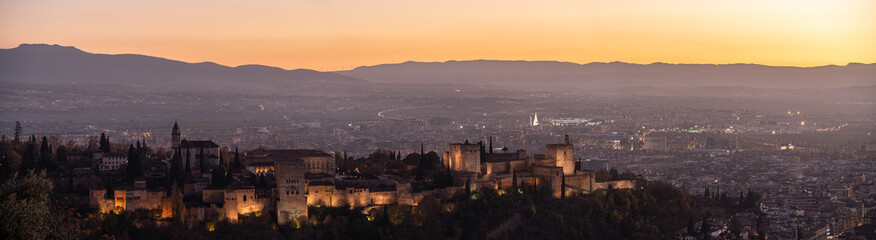 cityscape with La Alhambra of Granada during sunset