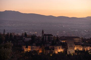 Obraz premium cityscape with La Alhambra of Granada during sunset