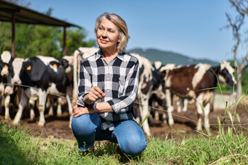 portrait of mature woman at cattle ranch farmers