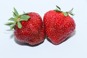 Bright juicy strawberries isolated on a white background. Delicious berries. Healthy eating