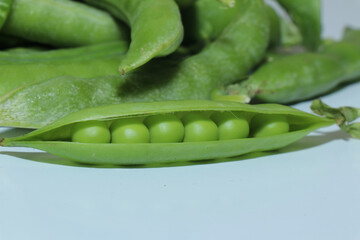 Pea pods isolated on a white background. Green peas. Healthy eating. Green plant