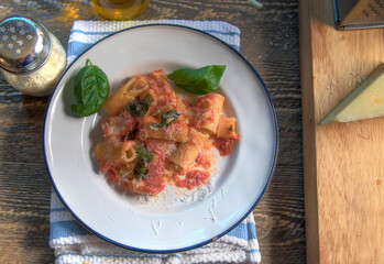 Top View of Baked Rigatoni on natural wood surface