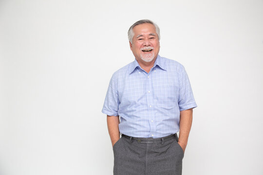 Portrait of senior asian man smile and looking at camera isolated over white background, Feeling happy concept