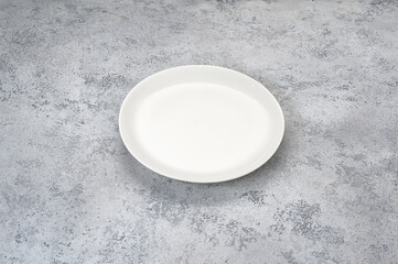 white plate on gray background