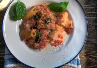 Top View of Baked Rigatoni on natural wood surface