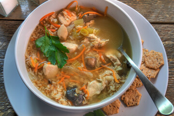 Top View Of Chicken and Rice Soup on natural wood surface.