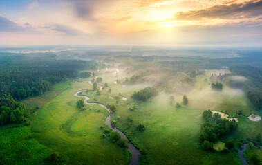 Aerial view of natural river during foggy morning - obrazy, fototapety, plakaty