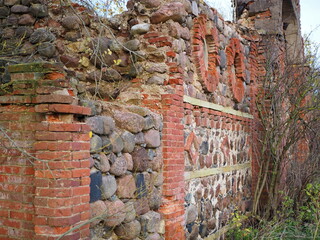 Beautiful stonework. The ruins of the old outbuildings of the estate of the Wrangel barons in the village of Torosovo. Volosovsky district, Leningrad region, Russia.