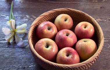 Top view of  Bowl of fugi apples on natural wood surface