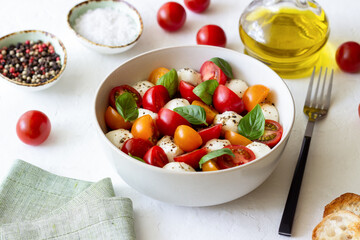 Salad with mozzarella, tomatoes and basil. Healthy eating. Vegetarian food.