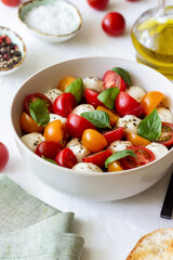 Salad with mozzarella, tomatoes and basil. Healthy eating. Vegetarian food.