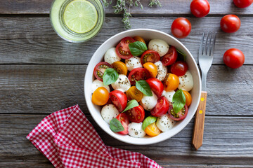 Salad with mozzarella, tomatoes and basil. Healthy eating. Vegetarian food.
