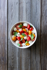 Salad with mozzarella, tomatoes and basil. Healthy eating. Vegetarian food.