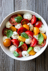 Salad with mozzarella, tomatoes and basil. Healthy eating. Vegetarian food.