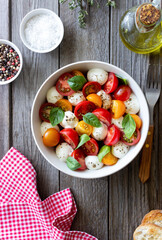 Salad with mozzarella, tomatoes and basil. Healthy eating. Vegetarian food.