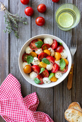 Salad with mozzarella, tomatoes and basil. Healthy eating. Vegetarian food.