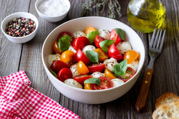 Salad with mozzarella, tomatoes and basil. Healthy eating. Vegetarian food.