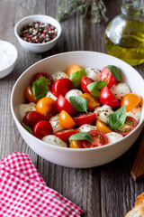Salad with mozzarella, tomatoes and basil. Healthy eating. Vegetarian food.