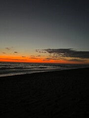 Fototapeta na wymiar Orange Sunset over the Ocean