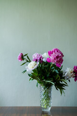 bouquet of flowers in vase. bouquet of white and pink peonies in a vase.