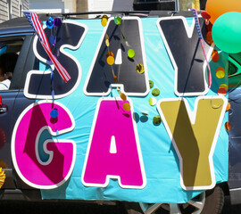 Say Gay letters on a car as decoration for gay pride parade