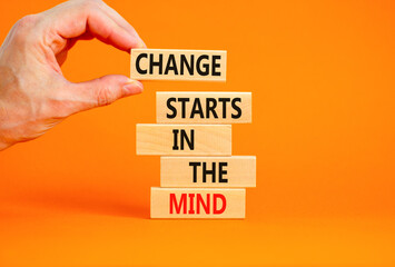 Change starts in the mind symbol. Concept words Change starts in the mind on wooden blocks on a beautiful orange table orange background. Business motivational and change starts in the mind concept.