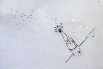 Fototapeta premium Continuous line drawing of champagne bottle with colored fireworks flakes. Flat lay of Celebration. Abstract champagne bottle.